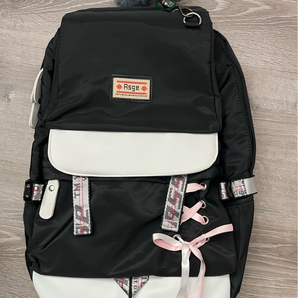 Asge Black and White Backpack with Pink Accents and Pom Poms